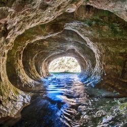 Test your courage in the Cave Stream on a Pilgrimage to New Zealand with Wonder Voyage