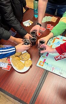 Team plays board games at An Tobar Nua on a faith-based trip to Ireland