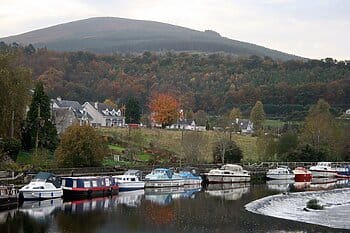 Boats and houses at Graiguenamanagh for Wonder Voyage blog post about Ireland pilgrimage tour
