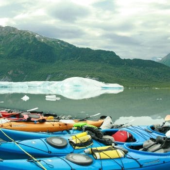 Image of kayaks in Alaska for Wonder Voyage blog about group travel