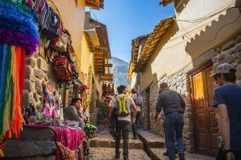 Image of person walking in Cusco, Peru market