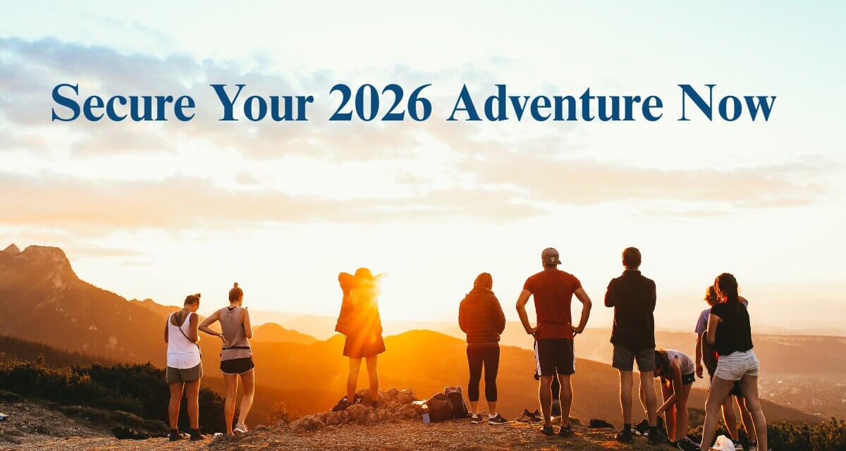 Secure Your 2026 Adventure Now Group of hikers on a mountain watching sunset with Wonder Voyage blog title Secure Your 2026 Adventure Now