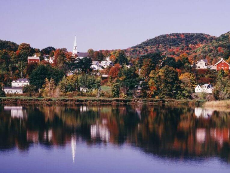 Vermont town reflecting in the water