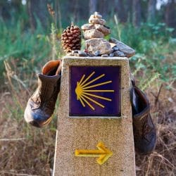 Tokens left on a marker along the Camino de Santiago.