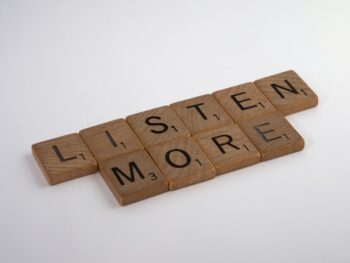 scrabble tiles spell out listen more